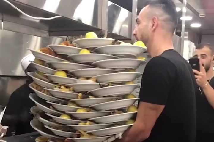 Super Waiter Carries 31 Plates